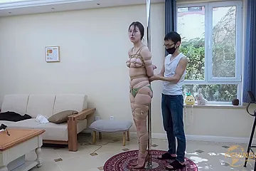 Tied to a pole with dildo gag - free porn video